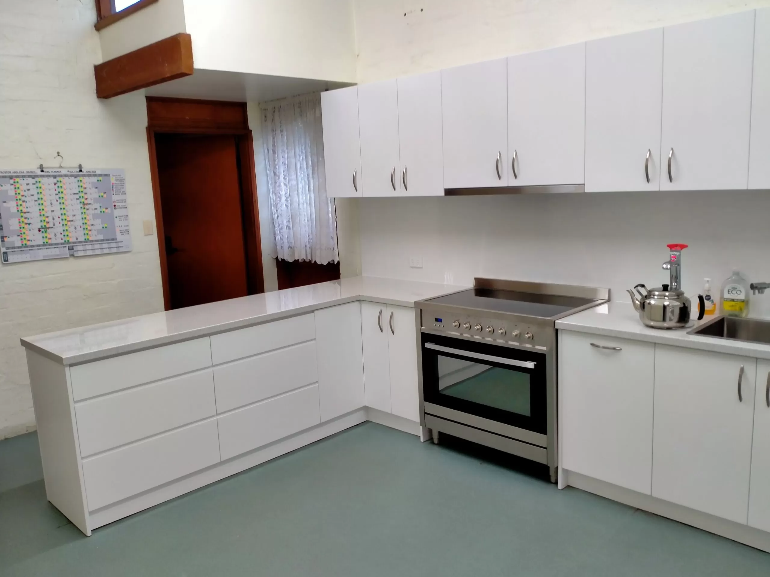 Closeup-White Minimalist Peninsula Kitchen