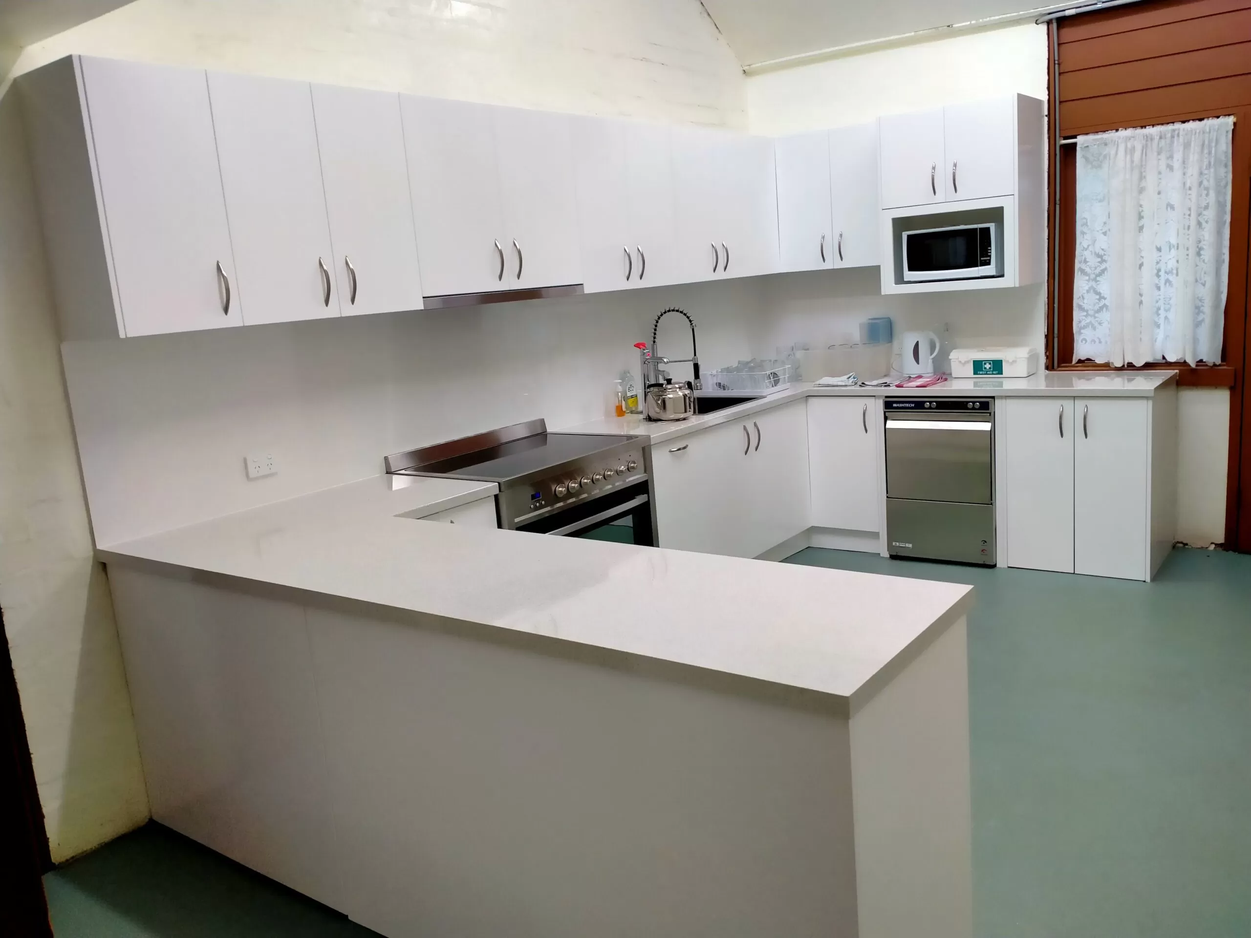 Outline-White Minimalist Peninsula Kitchen