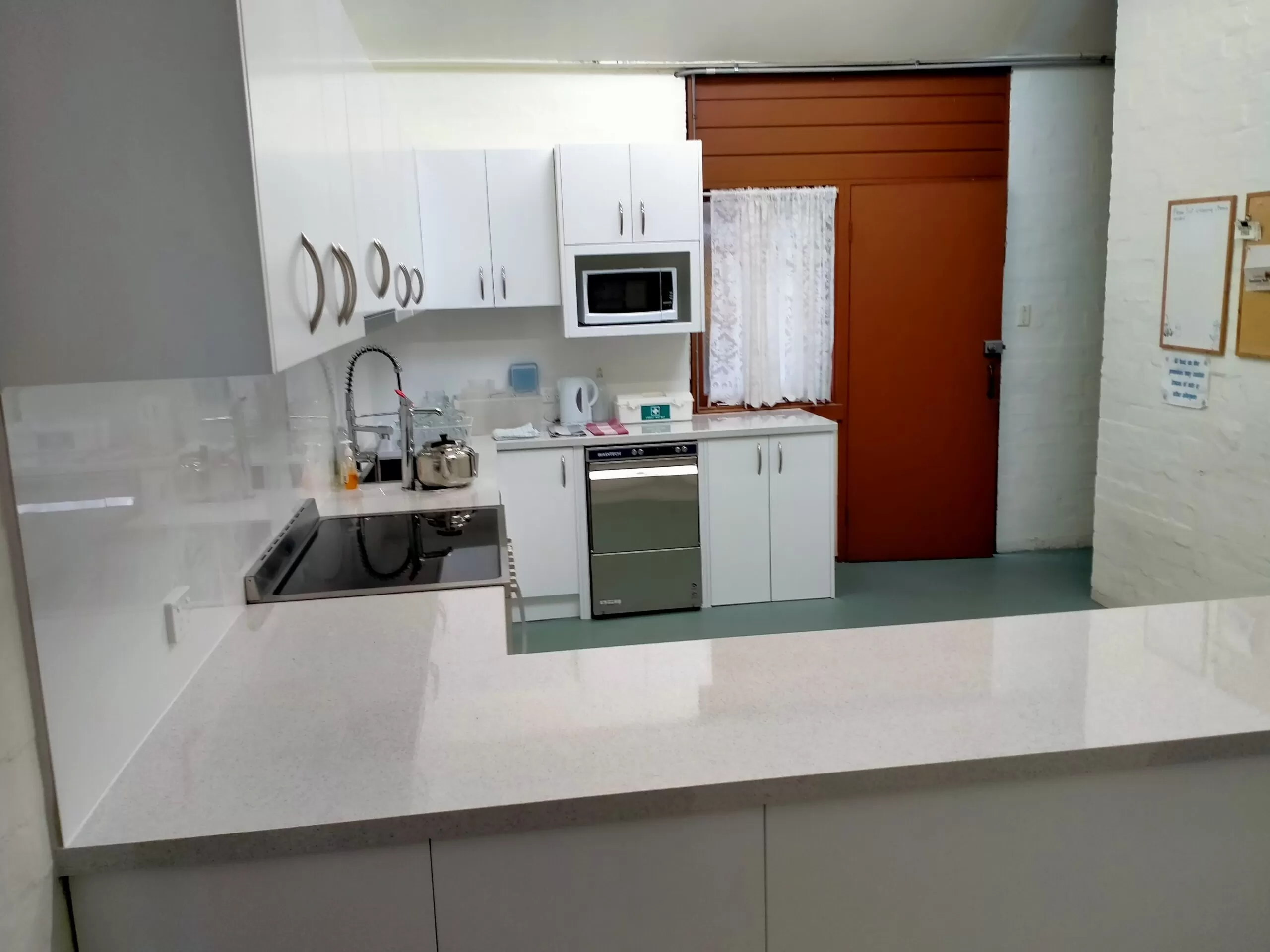 Sideview-White Minimalist Peninsula Kitchen